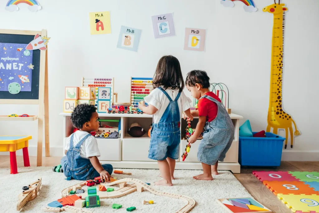 Young children playing in a bright preschool room