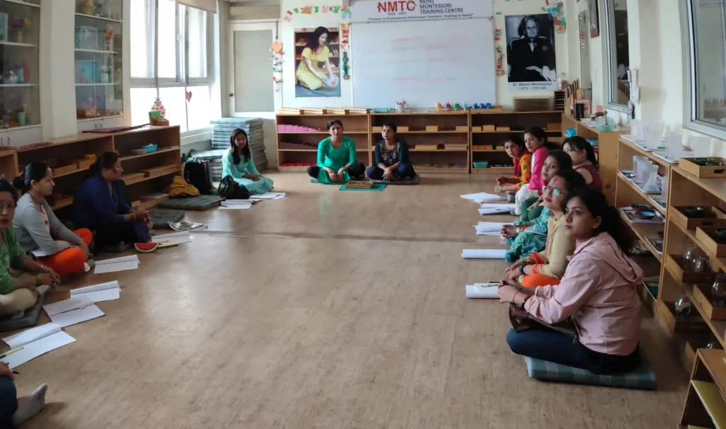 Trainees working in a prepared Montessori classroom at NMTC